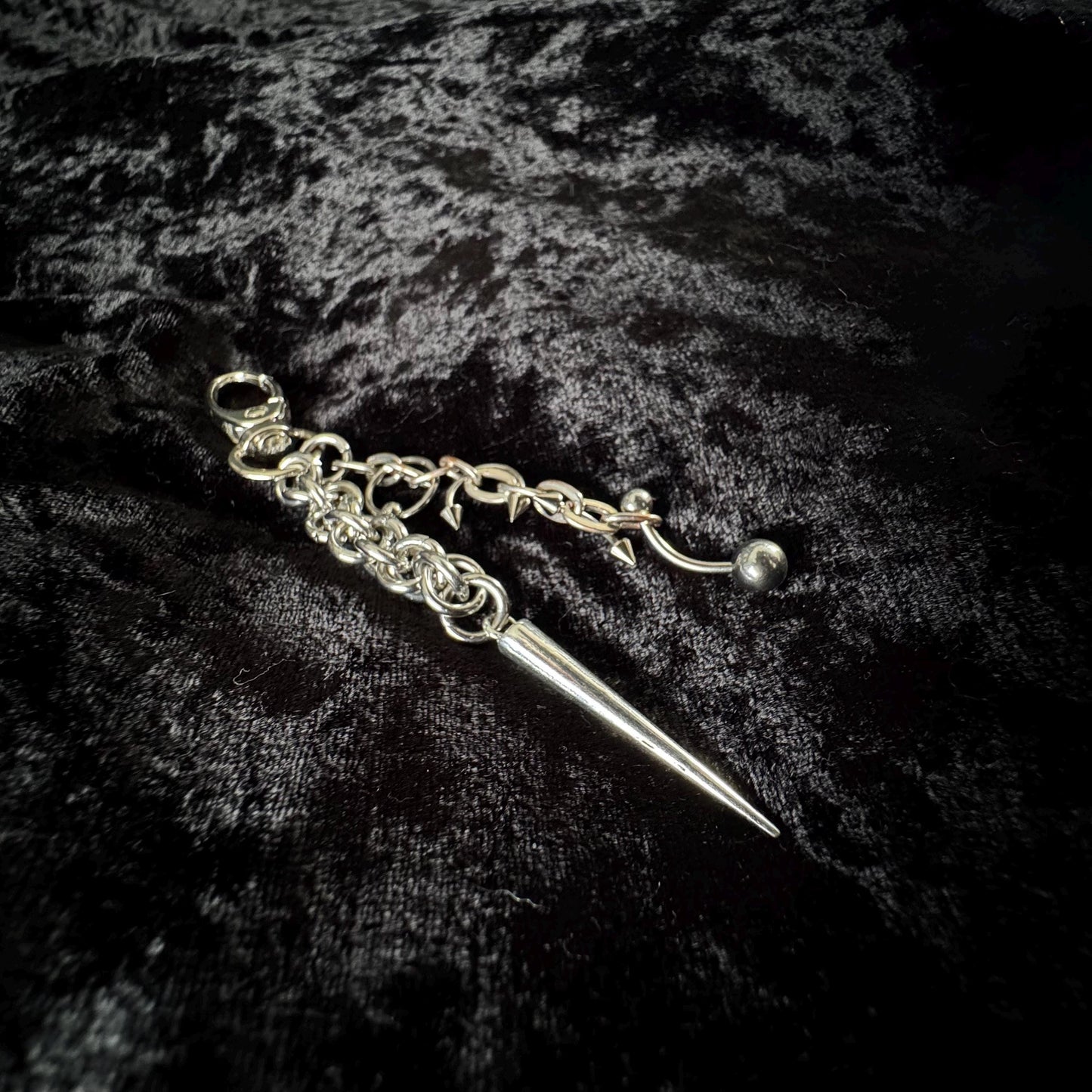Pierced spike chainmail bag charm